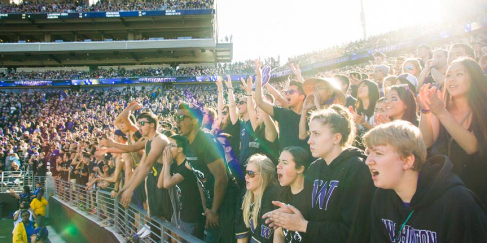 Fans attend a University of Washington Husky football game at Husky Stadium.