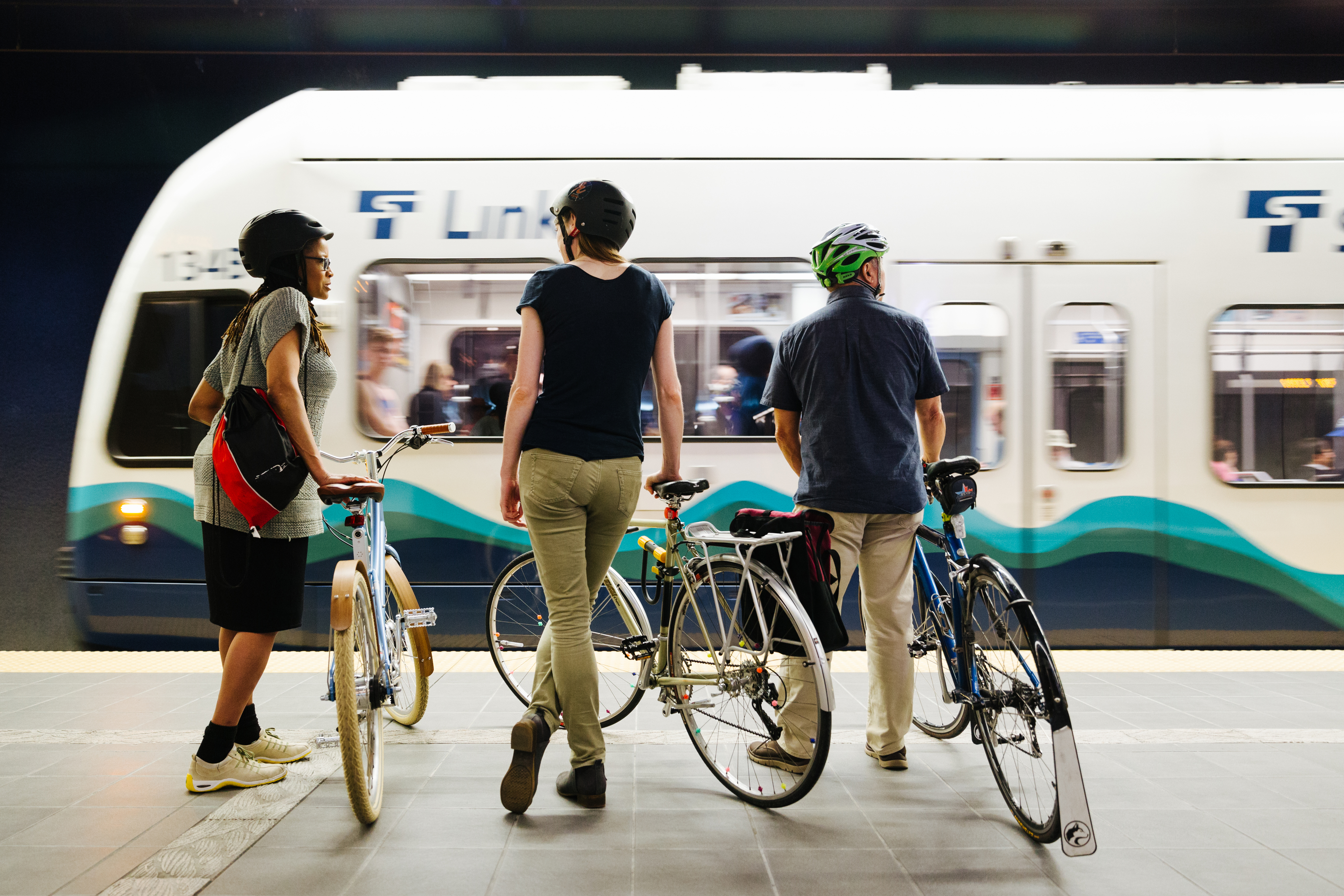 People by bikes and link train