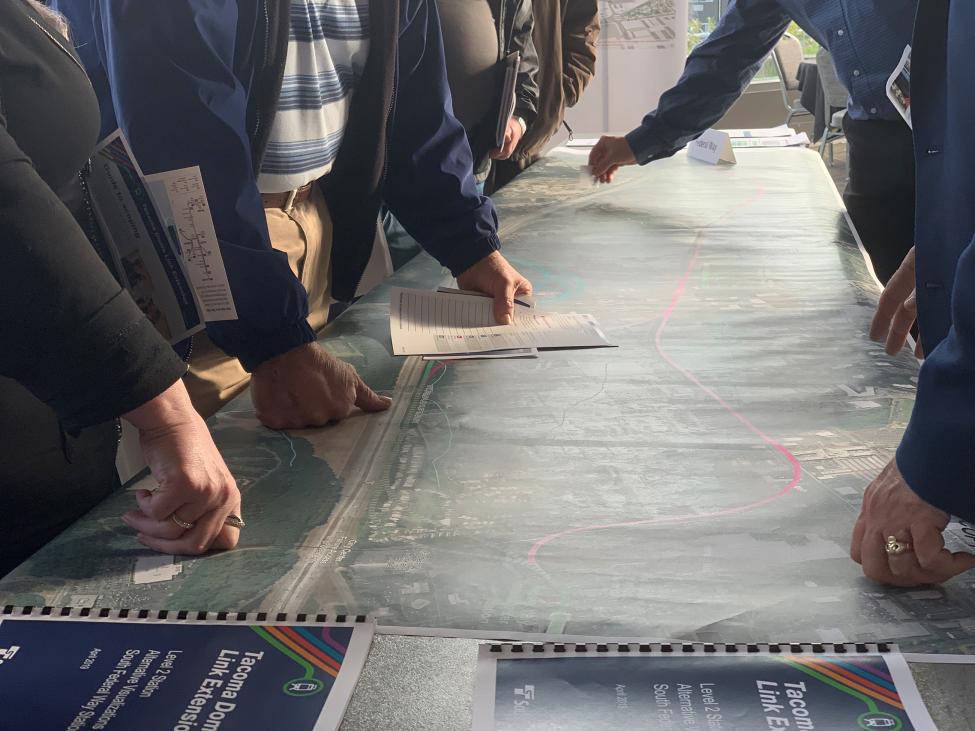 Residents look at proposed alignments for the future Tacoma Dome Link Extension.