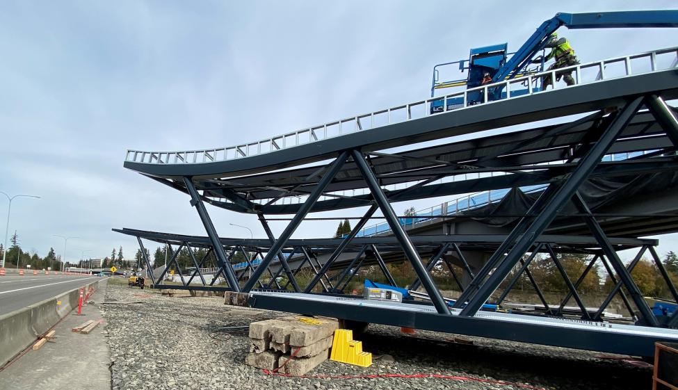 Pedestrian bridge truss segments on eastbound SR 520 shoulder at Northeast 148th Street.