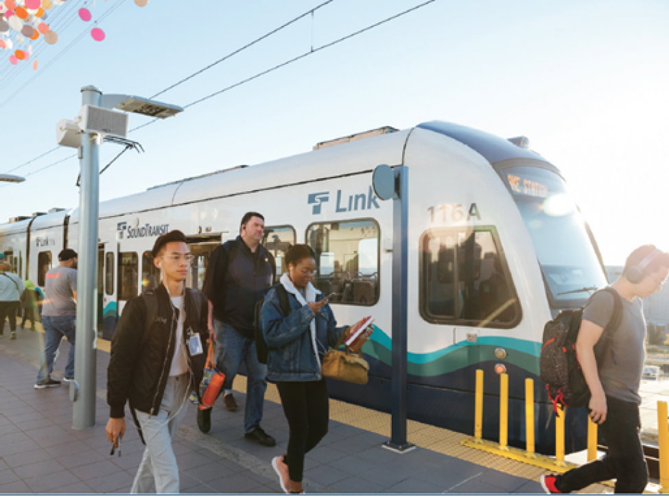 Tacoma Dome Link Extension project update header, image of riders exiting the train
