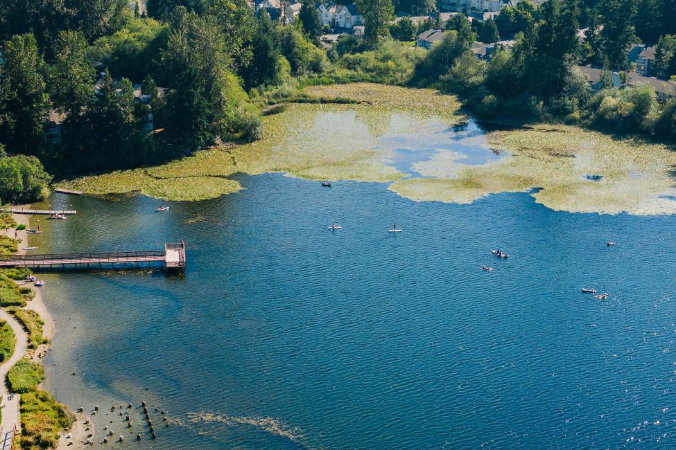 An aerial view of Silver Lake with a dock on the left side