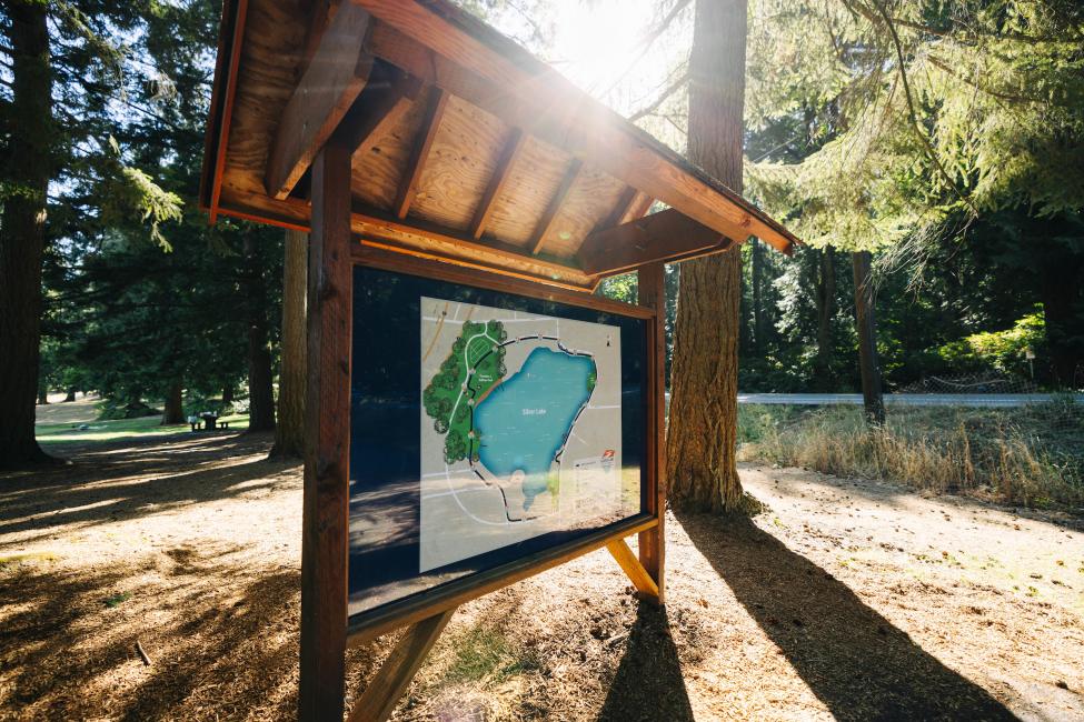 A large sign shows the walking path at SIlver Lake