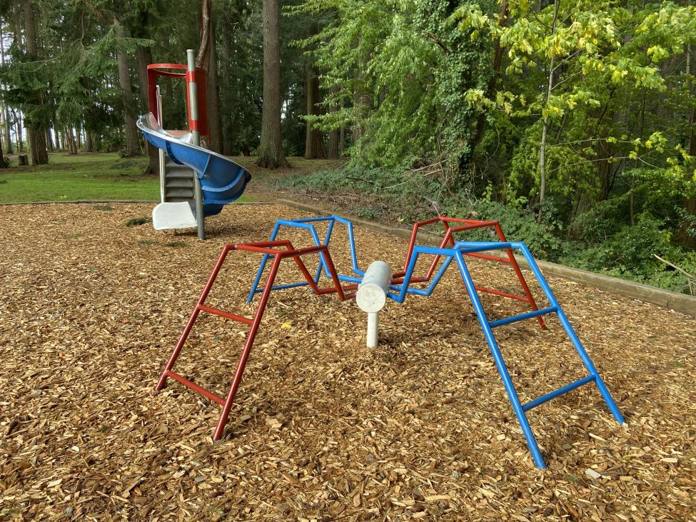 A colorful play structure in a park