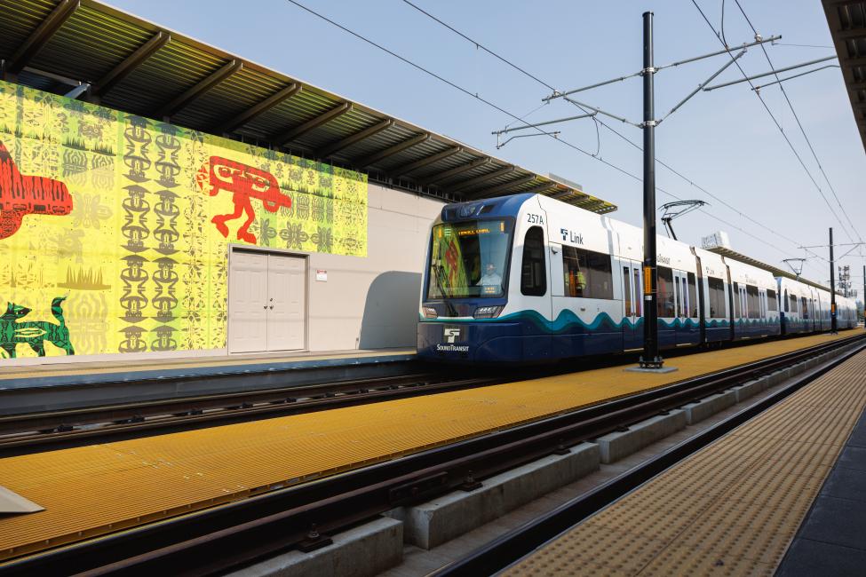 Temporary art is seen on the walls of a Link station under construction