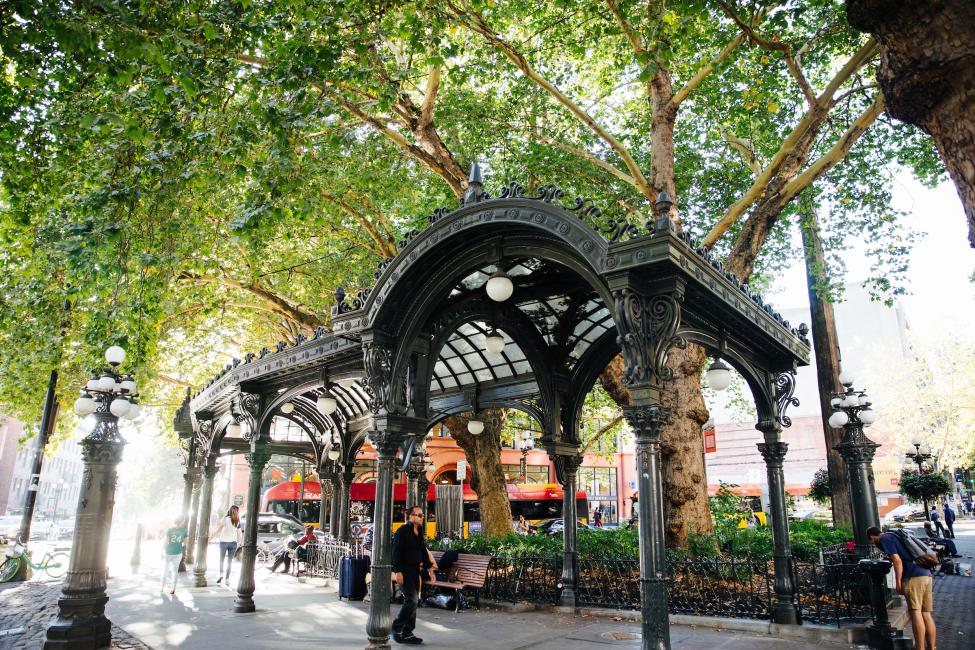 People walk through Pioneer Square in downtown Seattle