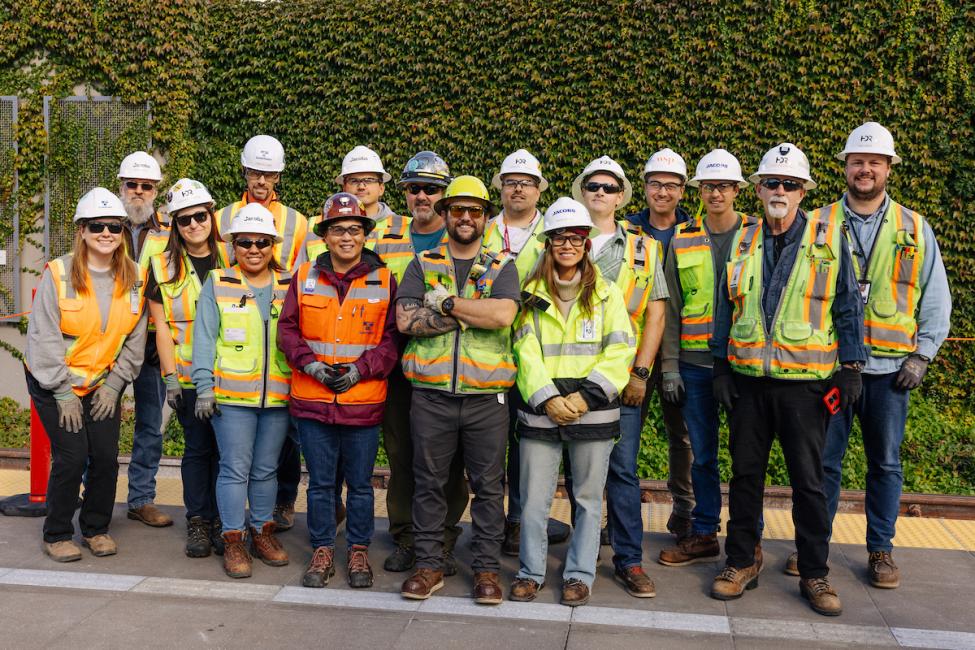 A group photo of about 20 construction workers