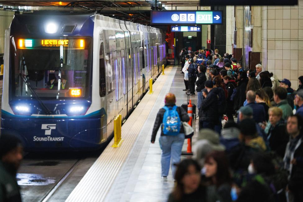 Crowds wait to board a Link light rail train
