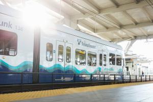 Photo of a Link train at a station, West Seattle and Ballard Link Extensions