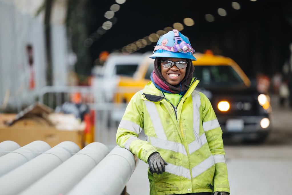 A worker at a construction site along the East Link extension.